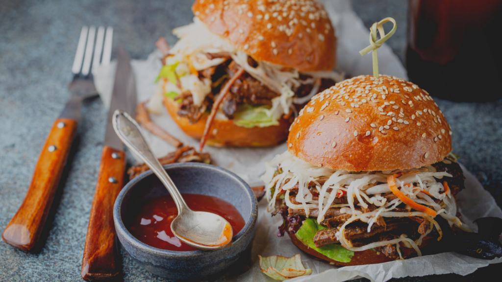 Pulled beef burger buns with sauce in bowl